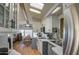 Open-concept kitchen seamlessly flowing into dining area with modern fixtures and ample storage at 7750 E Broadway Rd # 906, Mesa, AZ 85208