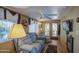 Inviting living room with comfortable seating, a fireplace, and access to the outdoors at 7750 E Broadway Rd # 906, Mesa, AZ 85208