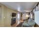 Comfortable living room with a fireplace, plush sofa, and built-in shelves at 7750 E Broadway Rd # 906, Mesa, AZ 85208