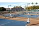 Active tennis courts surrounded by lush landscaping and spectators, perfect for enthusiasts at 7750 E Broadway Rd # 906, Mesa, AZ 85208
