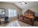 Main bedroom with large bed and wood flooring at 7820 W Willow Ave, Peoria, AZ 85381