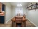 Bright dining room with wood table and chairs at 7820 W Willow Ave, Peoria, AZ 85381