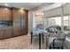 Cozy breakfast nook featuring a round glass table and large windows with backyard views at 7844 E Coolidge St, Scottsdale, AZ 85251