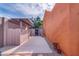 Property exterior featuring a neutral color palette, concrete area, landscaping, and privacy wall at 7844 E Coolidge St, Scottsdale, AZ 85251