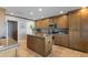 Well-equipped kitchen offering granite countertops, a center island, and stainless steel appliances at 7844 E Coolidge St, Scottsdale, AZ 85251