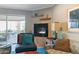Cozy living area with plush seating, a fireplace, and seamless access to the patio at 7844 E Coolidge St, Scottsdale, AZ 85251