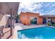 Inviting pool area with clear blue water, shaded lounge, and views of the home's modern architecture at 7844 E Coolidge St, Scottsdale, AZ 85251