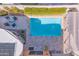 Aerial view of a pristine pool area with lounge furniture, creating an inviting outdoor oasis at 7844 E Coolidge St, Scottsdale, AZ 85251