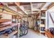 Storage room featuring neatly stacked shelves and hanging gardening tools at 7844 E Coolidge St, Scottsdale, AZ 85251