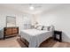 Calm bedroom with a bed, mirror, and shuttered windows at 8708 E San Lucas Dr, Scottsdale, AZ 85258
