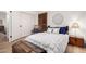 Comfortable bedroom with a large bed, wood floors, and a vintage trunk at 8708 E San Lucas Dr, Scottsdale, AZ 85258