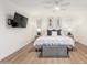 Bright bedroom with a large bed, TV, and stylish decor at 8708 E San Lucas Dr, Scottsdale, AZ 85258