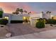 Landscaped home exterior featuring desert plants, palm trees, and brick driveway at 8708 E San Lucas Dr, Scottsdale, AZ 85258