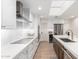 Contemporary kitchen with white cabinets, stainless steel appliances, and ample counter space at 8708 E San Lucas Dr, Scottsdale, AZ 85258