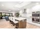 Modern kitchen featuring a large island with seating and stainless steel double ovens at 8708 E San Lucas Dr, Scottsdale, AZ 85258