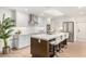 Bright, modern kitchen featuring a large island, white cabinets, and stainless steel appliances at 8708 E San Lucas Dr, Scottsdale, AZ 85258