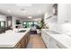 Bright, open kitchen featuring white cabinets, stainless steel appliances, and a spacious island at 8708 E San Lucas Dr, Scottsdale, AZ 85258