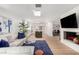 Bright living room featuring modern decor, hardwood floors, and a view of the kitchen and dining area at 8708 E San Lucas Dr, Scottsdale, AZ 85258