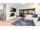 Stylish living room with sleek furnishings, modern fireplace, and open access to the outdoor area at 8708 E San Lucas Dr, Scottsdale, AZ 85258
