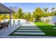 Artificial turf, stone pathway, and pool view at 8726 E Via De La Gente --, Scottsdale, AZ 85258