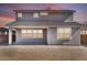 Exterior of home featuring a covered patio and a large yard with windows facing the backyard at 9036 S 196Th Dr, Goodyear, AZ 85338