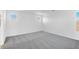 Spacious bedroom with soft carpet, white walls, recessed lights, and multiple windows with neighborhood views at 9036 S 196Th Dr, Goodyear, AZ 85338