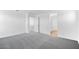 Large bedroom with soft carpet, white walls, recessed lights, walk-in closet, and access to an ensuite bathroom at 9036 S 196Th Dr, Goodyear, AZ 85338