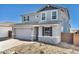 Charming two-story home featuring stone accents, neutral paint, an attached two-car garage and a low maintenance front yard at 9036 S 196Th Dr, Goodyear, AZ 85338