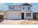 Charming two-story home featuring stone accents, neutral paint and an attached two-car garage with brick paver driveway at 9036 S 196Th Dr, Goodyear, AZ 85338