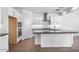 Kitchen featuring stainless steel appliances, gray counters, island and white cabinets at 9036 S 196Th Dr, Goodyear, AZ 85338