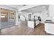 Open concept with stainless steel appliances, sleek countertops, and sliding glass doors at 9036 S 196Th Dr, Goodyear, AZ 85338