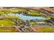 Community featuring a lake, playground, and sports fields at 11682 W Parkway Ln, Avondale, AZ 85323