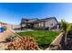 Home with a large backyard, pool, and grassy area at 11682 W Parkway Ln, Avondale, AZ 85323