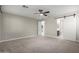 Spacious bedroom with carpeted floor and ceiling fan at 11682 W Parkway Ln, Avondale, AZ 85323