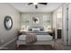 Bright bedroom featuring a queen bed and ensuite bathroom at 11682 W Parkway Ln, Avondale, AZ 85323