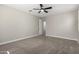 Spacious bedroom with carpeted floors and ceiling fan at 11682 W Parkway Ln, Avondale, AZ 85323