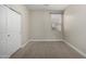 Small bedroom with closet and window at 11682 W Parkway Ln, Avondale, AZ 85323