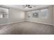 Large bedroom featuring neutral walls and plush carpeting at 11682 W Parkway Ln, Avondale, AZ 85323
