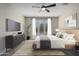 Main bedroom with large windows and a stylish dresser at 11682 W Parkway Ln, Avondale, AZ 85323