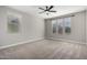 Spacious bedroom with window and ceiling fan at 11682 W Parkway Ln, Avondale, AZ 85323
