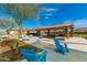 Community gathering space with cornhole and seating at 11682 W Parkway Ln, Avondale, AZ 85323