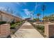 Walking path with decorative accents leading to a community area at 11682 W Parkway Ln, Avondale, AZ 85323