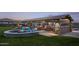Outdoor gathering space with fire pit, seating, and grill at 11682 W Parkway Ln, Avondale, AZ 85323