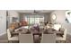Elegant dining room with a large table and access to the living room at 11682 W Parkway Ln, Avondale, AZ 85323