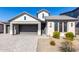 Modern two-story home with a brick facade and a two-car garage at 11682 W Parkway Ln, Avondale, AZ 85323