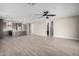 Open concept living room with kitchen and tile floors at 11682 W Parkway Ln, Avondale, AZ 85323