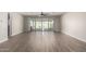 Spacious living area showcasing tile floors and access to the backyard pool at 11682 W Parkway Ln, Avondale, AZ 85323