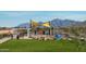 playground with shade structures, play equipment, and picnic tables at 11682 W Parkway Ln, Avondale, AZ 85323