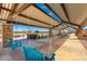 Covered patio area with swings and views of the neighborhood at 11682 W Parkway Ln, Avondale, AZ 85323