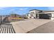 House exterior showcasing a front yard and driveway at 12220 S 204Th Dr, Buckeye, AZ 85326